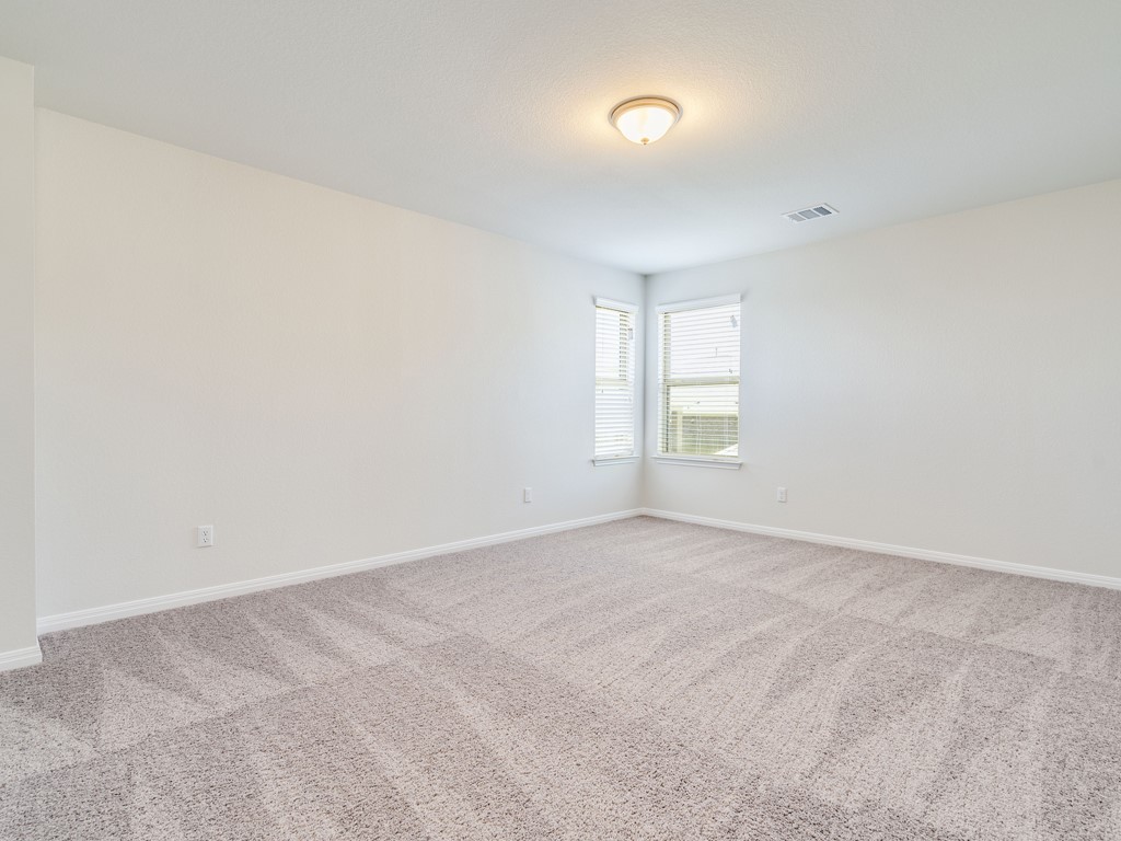 4113 Birdwatch Loop, Unit 21 Pflugerville, TX 78660 - Photo 14 of 30 an empty room with windows and closet
