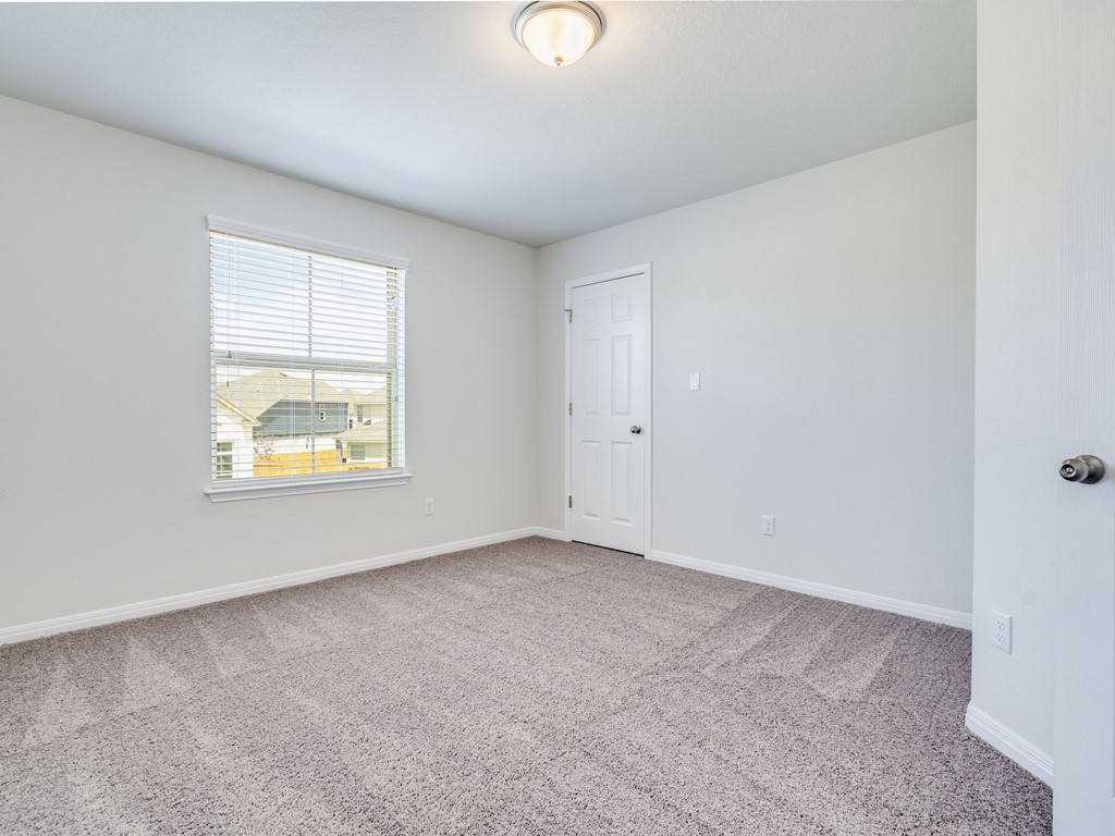 4113 Birdwatch Loop, Unit 21 Pflugerville, TX 78660 - Photo 20 of 30 an empty room with windows