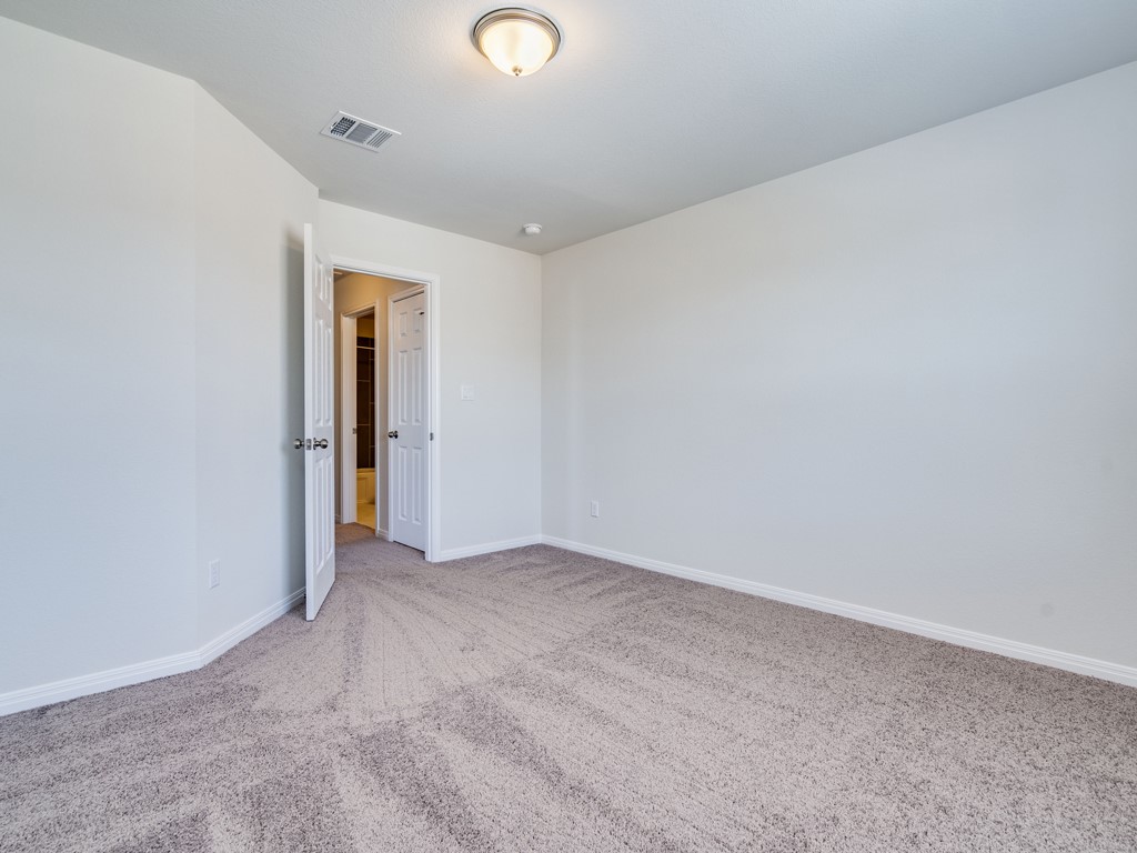 4113 Birdwatch Loop, Unit 21 Pflugerville, TX 78660 - Photo 21 of 30 an empty room with an entryway
