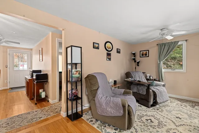 a living room with furniture rug and window