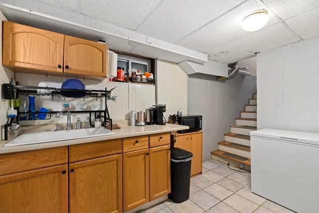 a kitchen with stainless steel appliances granite countertop a sink and cabinets