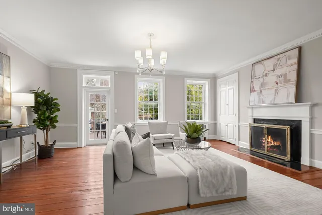 a spacious bedroom with a balcony a bed and a fireplace