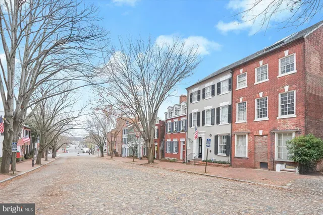 a view of a building with a yard