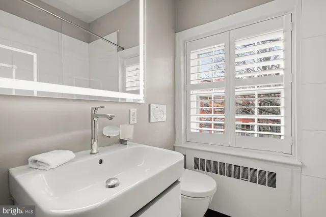 a bathroom with a sink and a toilet