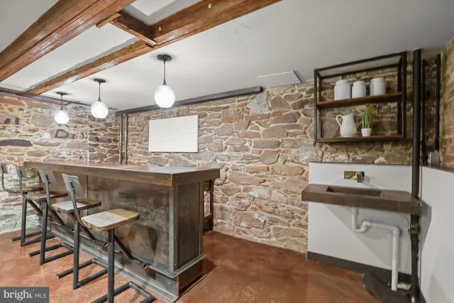 a kitchen with a sink cabinets and window
