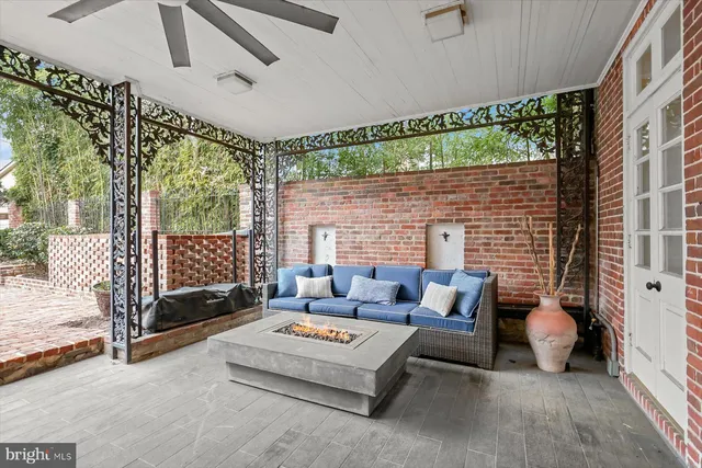 a outdoor living space with patio furniture and a fireplace