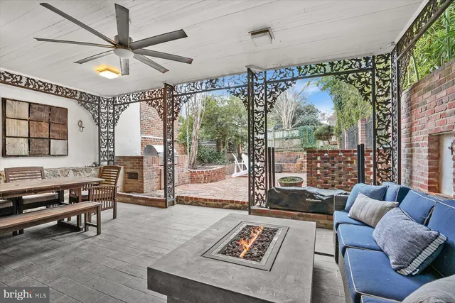 a living room with furniture a table and a large window