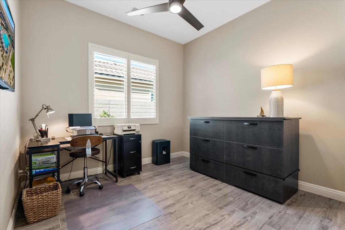 24 Claret Road Rancho Mirage, CA 92270 - Photo 15 of 34 a view of a workspace with furniture and a window