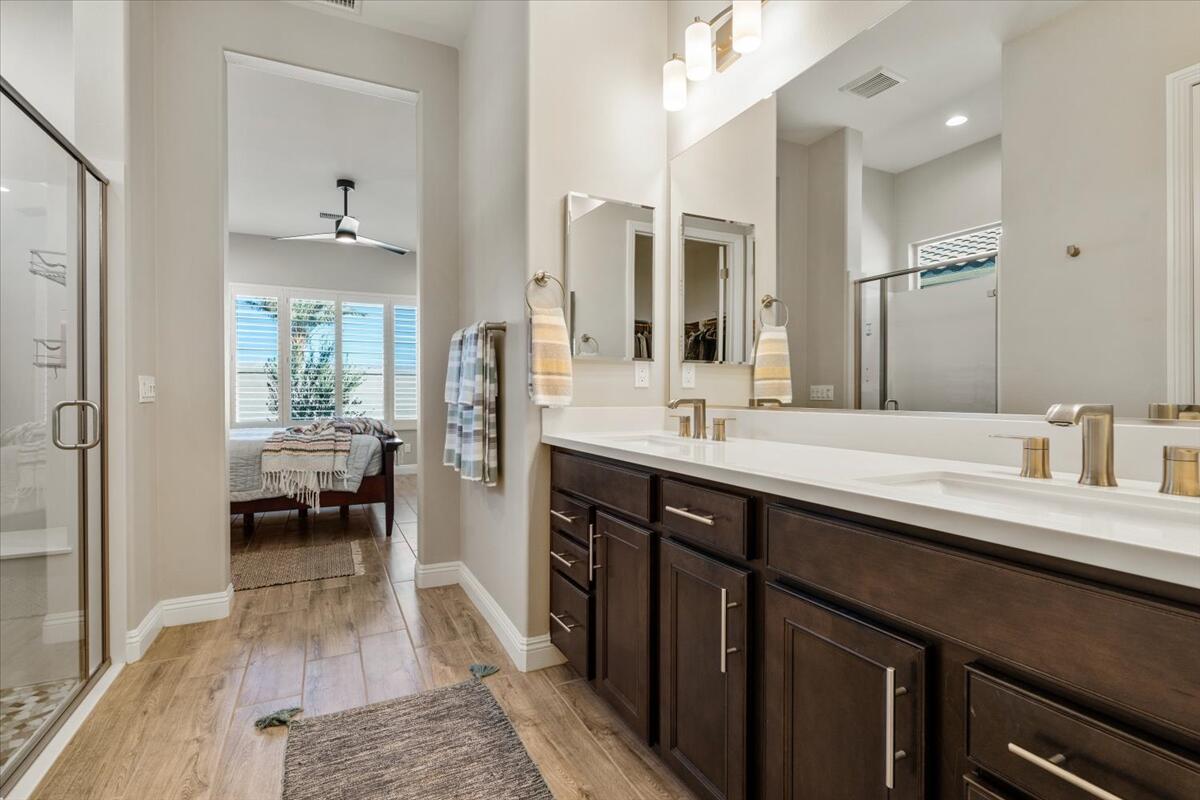 24 Claret Road Rancho Mirage, CA 92270 - Photo 17 of 34 a en suite bathroom with a sink double vanity and a shower