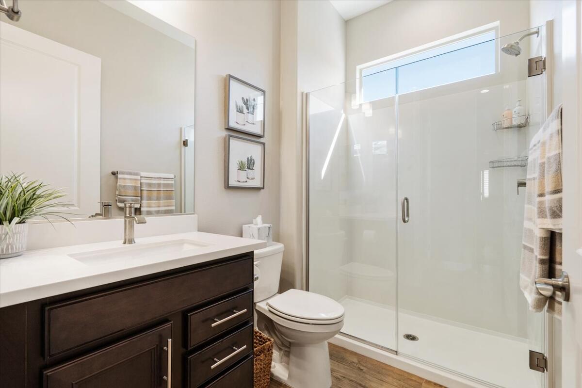 24 Claret Road Rancho Mirage, CA 92270 - Photo 18 of 34 a bathroom with a sink a toilet and shower