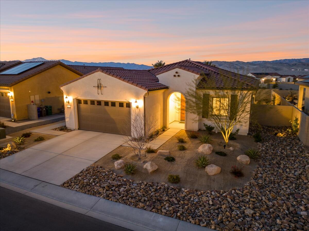 24 Claret Road Rancho Mirage, CA 92270 - Photo 34 of 34 a view of a chairs and table in front of house