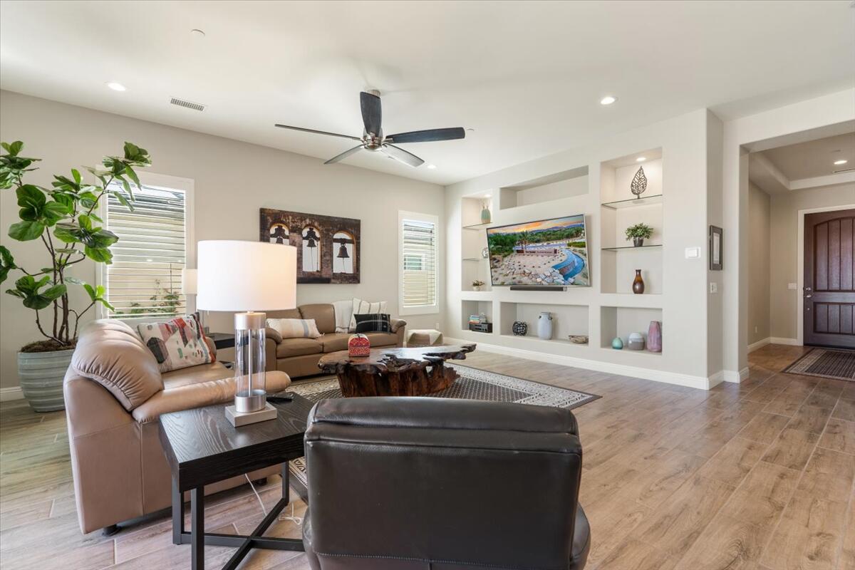 24 Claret Road Rancho Mirage, CA 92270 - Photo 7 of 34 a living room with furniture and a large window