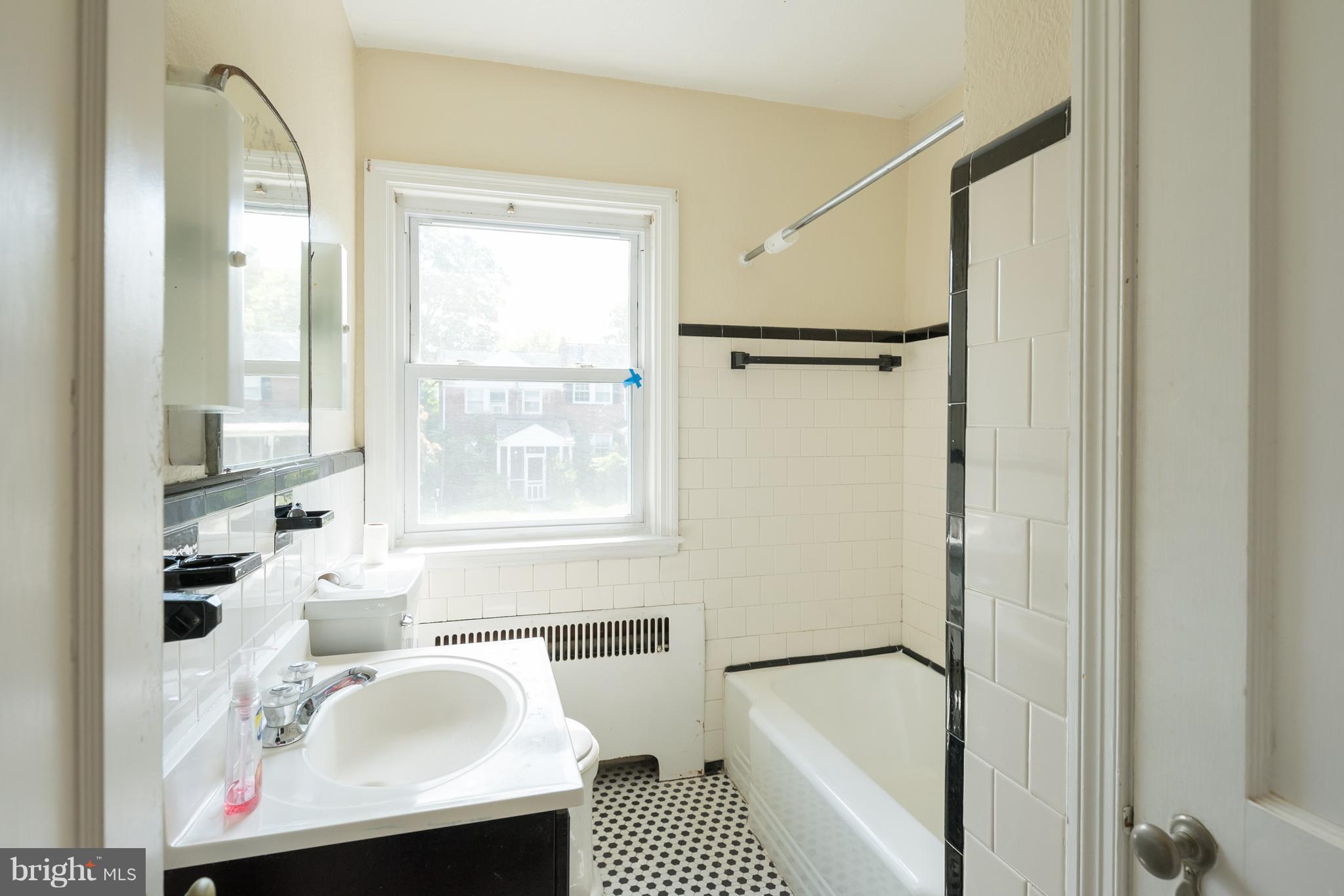 58 Burkleigh Road Baltimore, MD 21286 - Photo 14 of 23 a bathroom with a bathtub and a sink