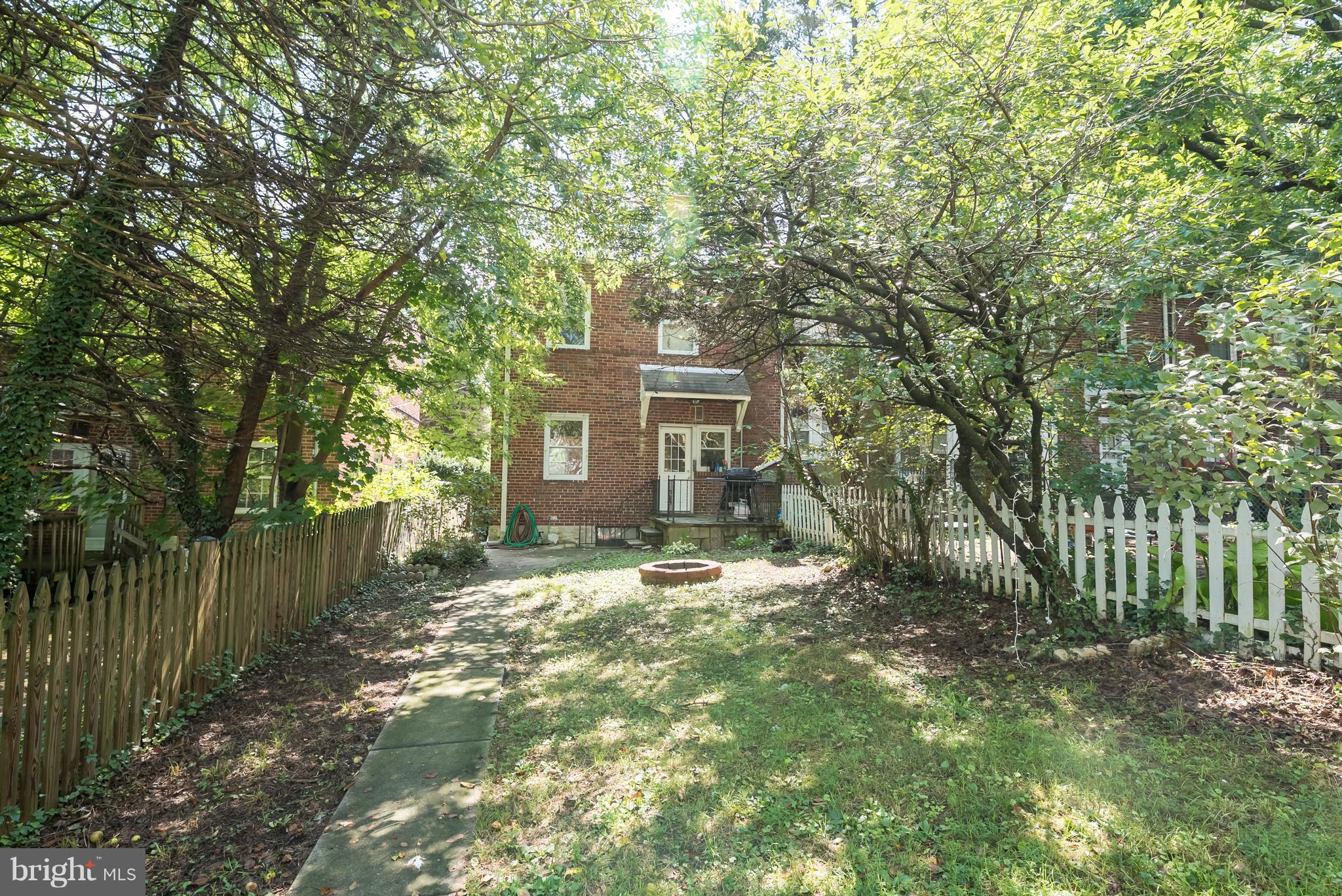 58 Burkleigh Road Baltimore, MD 21286 - Photo 23 of 23 a view of a yard with plants and large trees