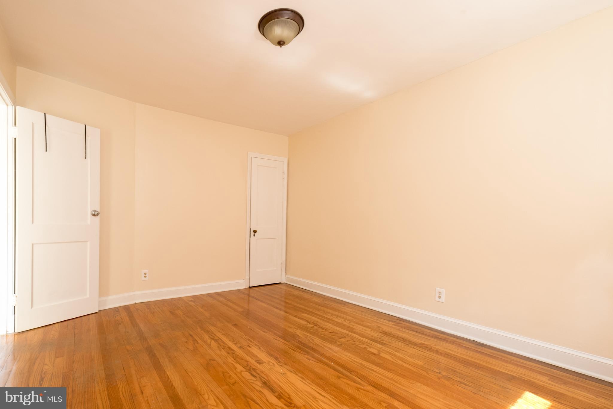 58 Burkleigh Road Baltimore, MD 21286 - Photo 8 of 23 a view of empty room with wooden floor