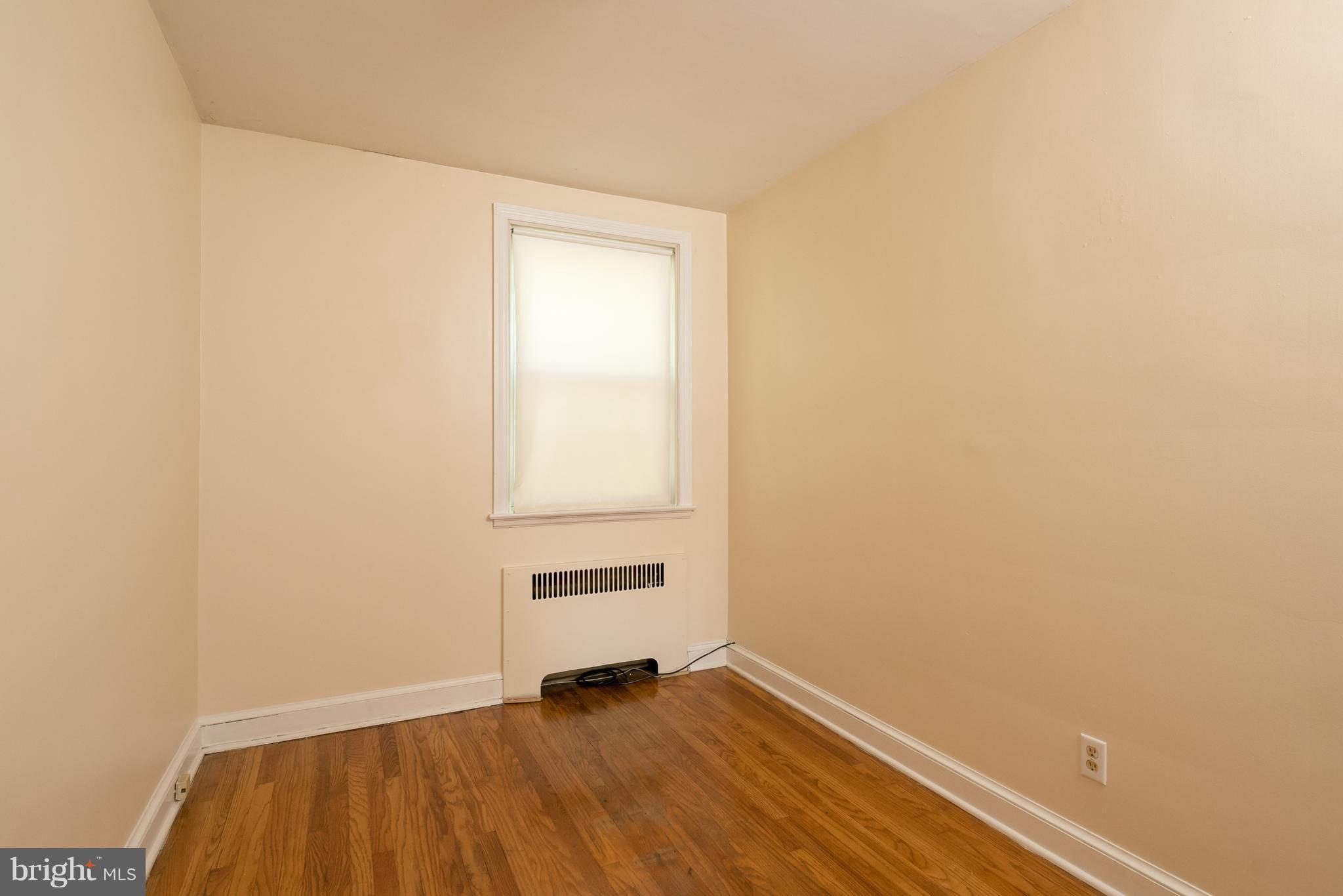 58 Burkleigh Road Baltimore, MD 21286 - Photo 10 of 23 a view of an empty room and wooden floor