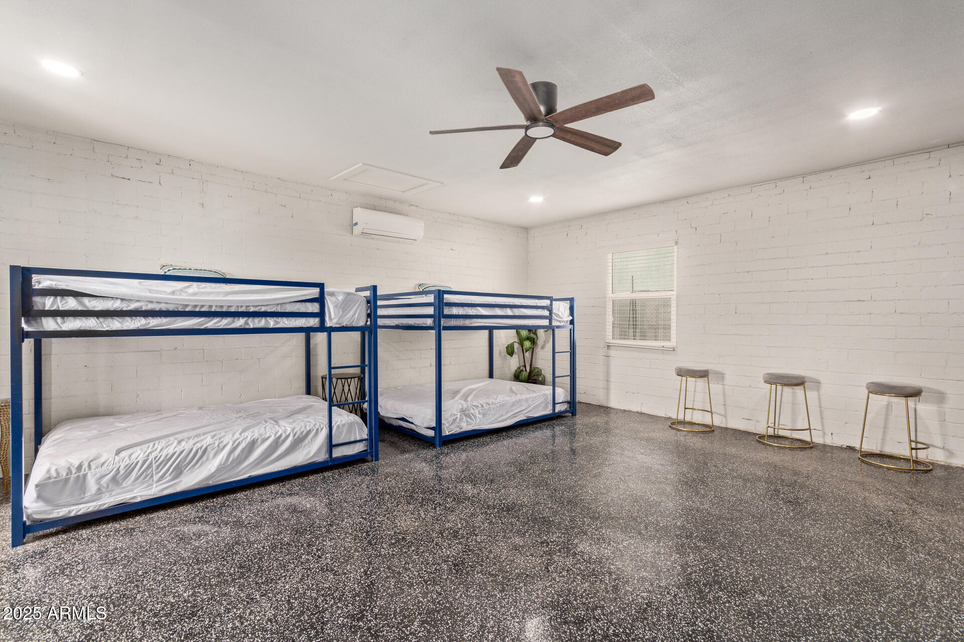 3132 North 15th Avenue Phoenix, AZ 85015 - Photo 13 of 28 a bedroom with a bed and window