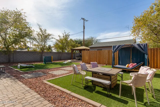 a view of a two chairs in the patio