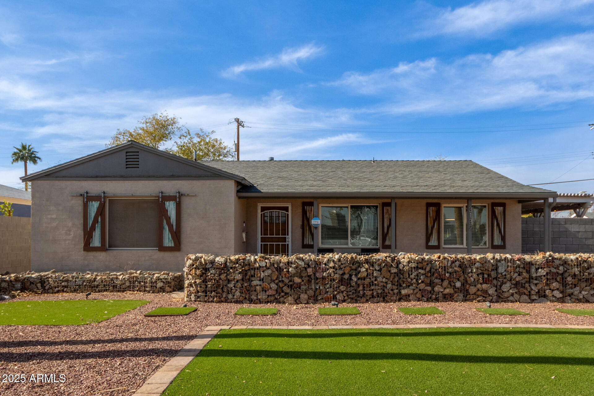 3132 North 15th Avenue Phoenix, AZ 85015 - Photo 5 of 28 a front view of a house with a garden