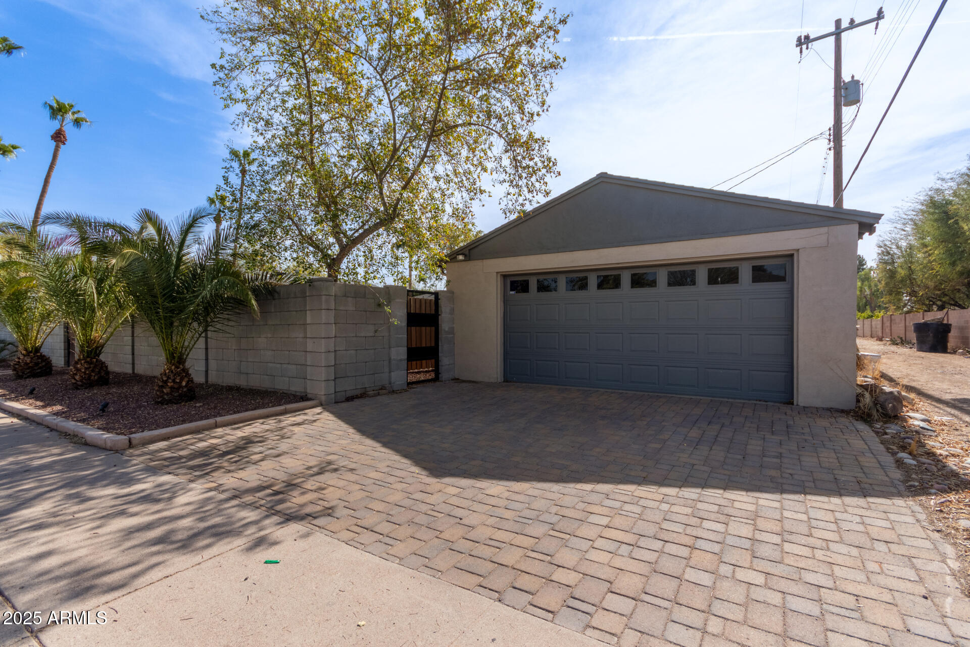 3132 North 15th Avenue Phoenix, AZ 85015 - Photo 7 of 28 a front view of a house with a yard and garage