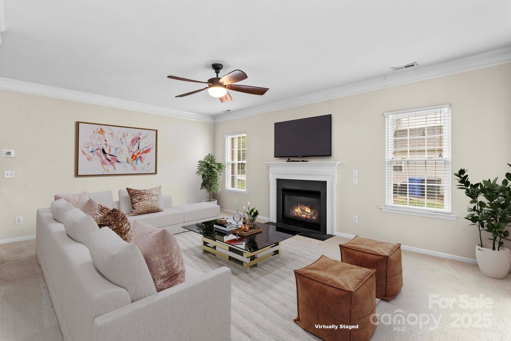 124 Elizabeth Hearth Road Mooresville, NC 28115 - Photo 15 of 48 a living room with furniture a fireplace and a flat screen tv