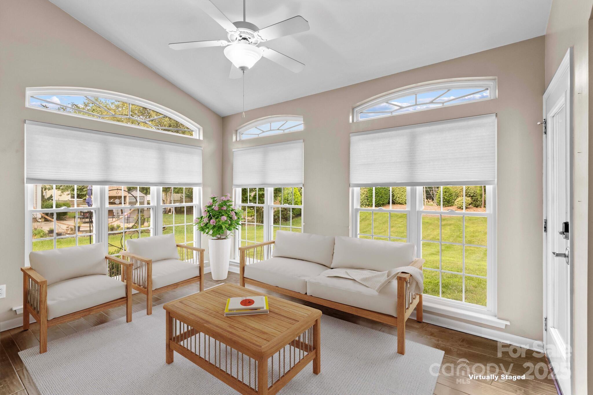 124 Elizabeth Hearth Road Mooresville, NC 28115 - Photo 19 of 48 a living room with furniture and a large window