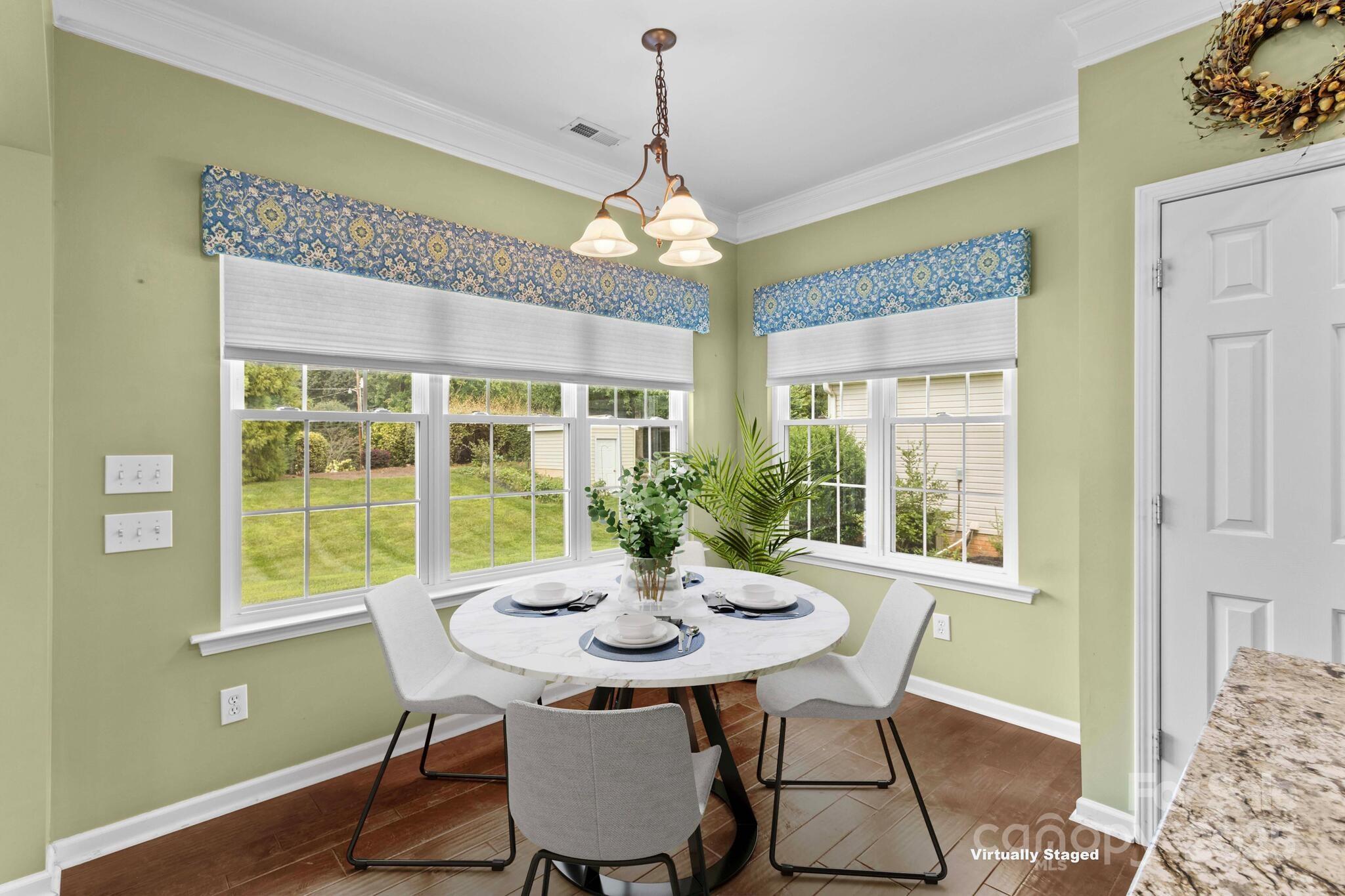124 Elizabeth Hearth Road Mooresville, NC 28115 - Photo 25 of 48 a view of a dining room with furniture window and outside view