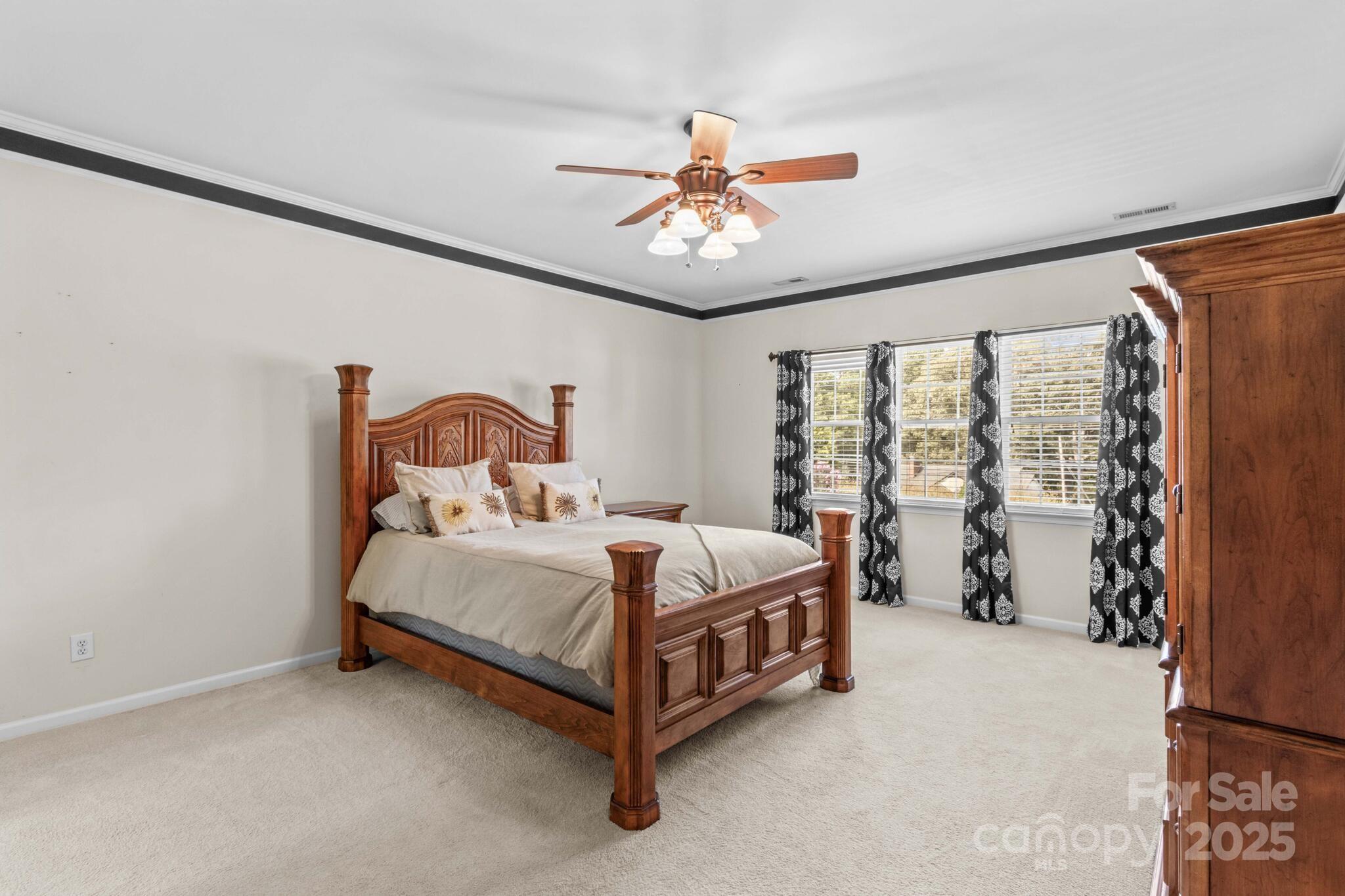 124 Elizabeth Hearth Road Mooresville, NC 28115 - Photo 29 of 48 a bed sitting in a room next to a window