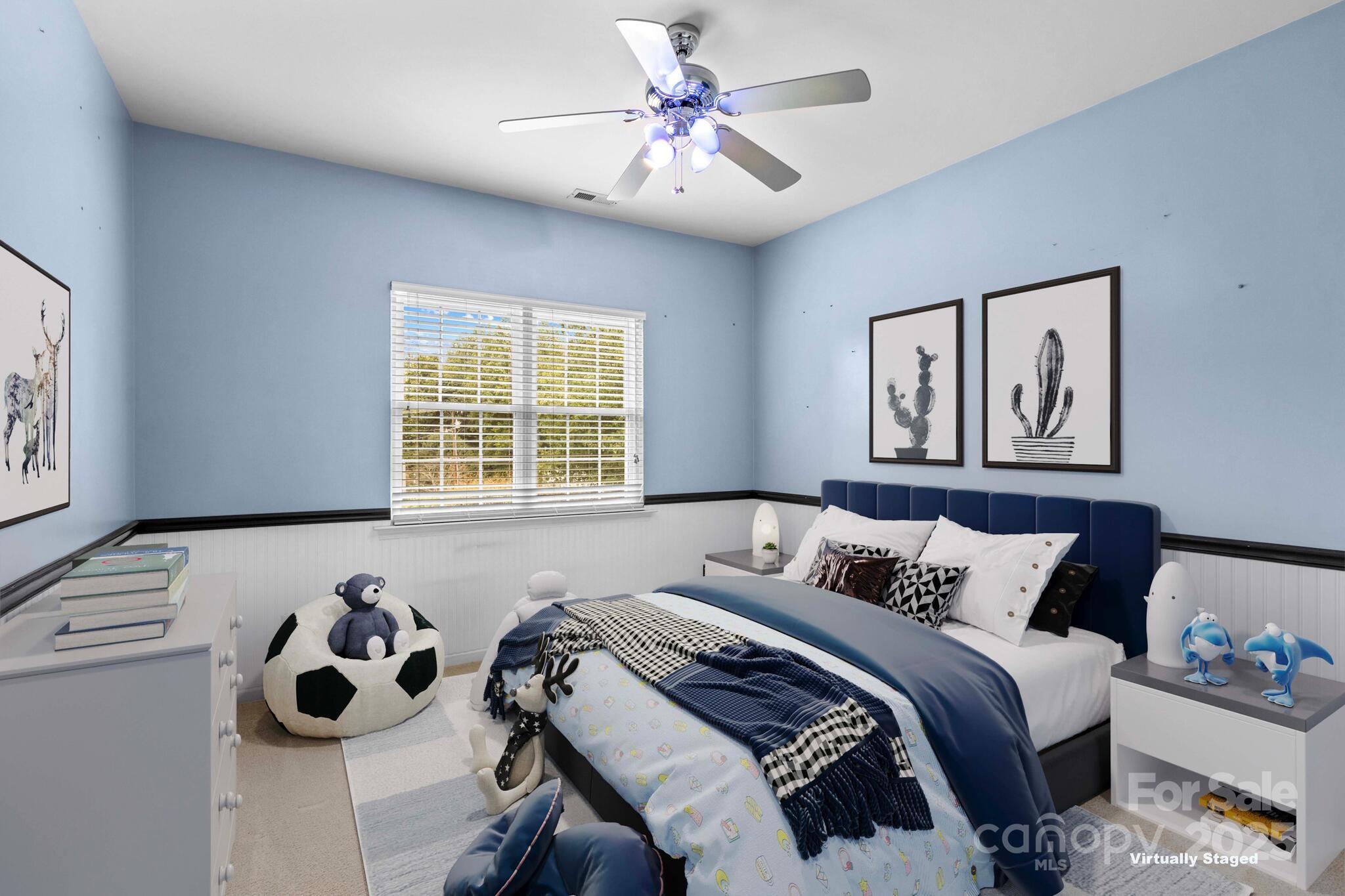 124 Elizabeth Hearth Road Mooresville, NC 28115 - Photo 35 of 48 a bedroom with a bed and a chandelier