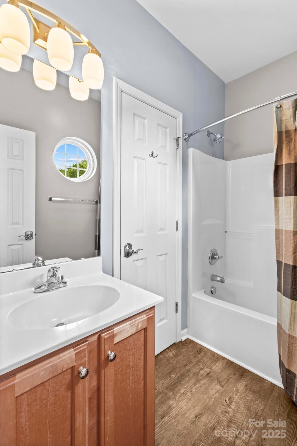 124 Elizabeth Hearth Road Mooresville, NC 28115 - Photo 38 of 48 a bathroom with a bathtub a sink and a shower