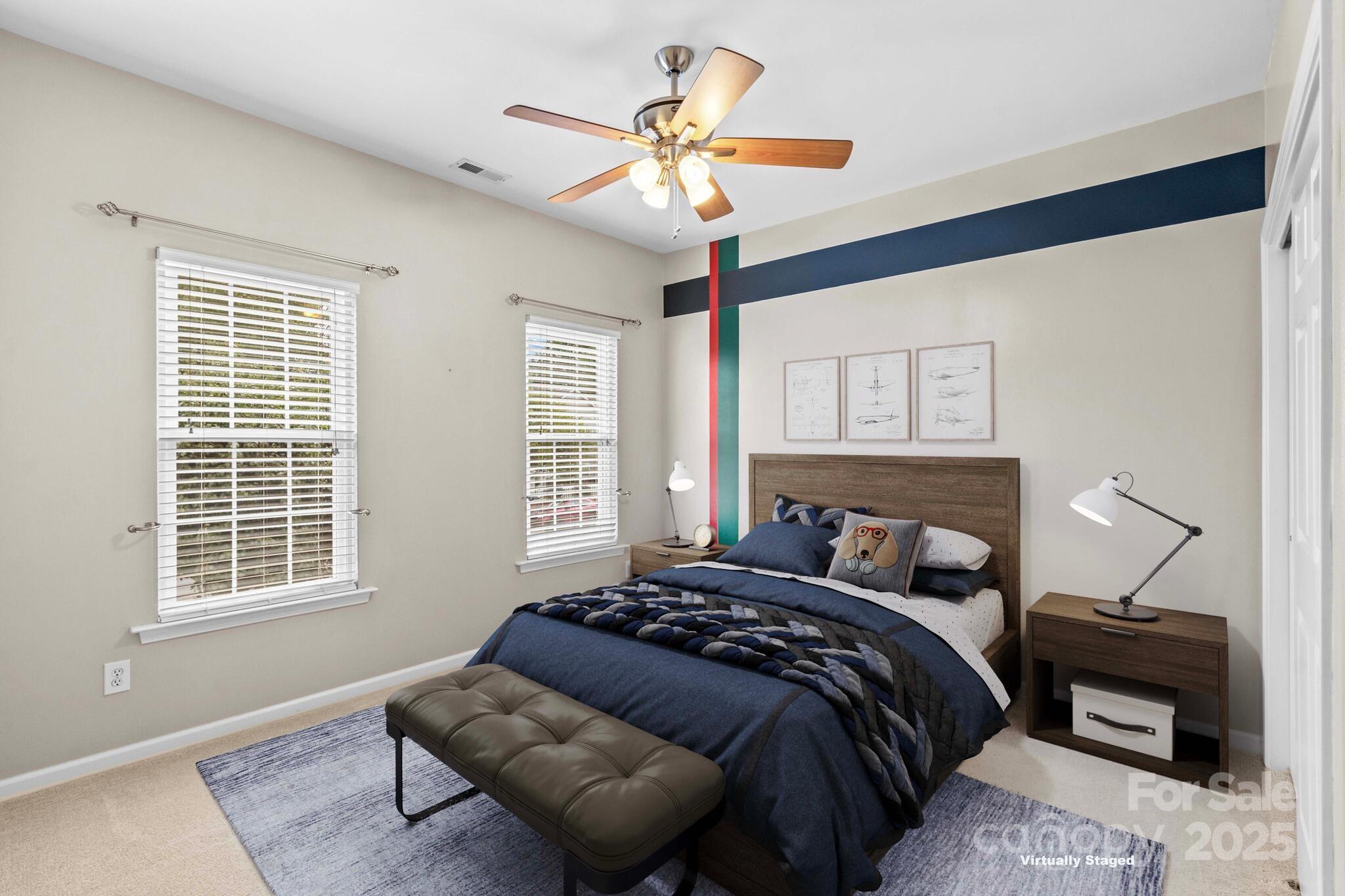 124 Elizabeth Hearth Road Mooresville, NC 28115 - Photo 39 of 48 a bedroom with a bed and a window