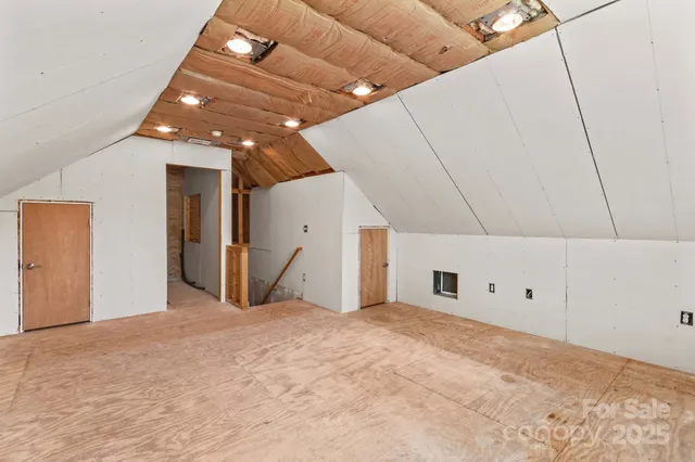 a big room with closet and chandelier