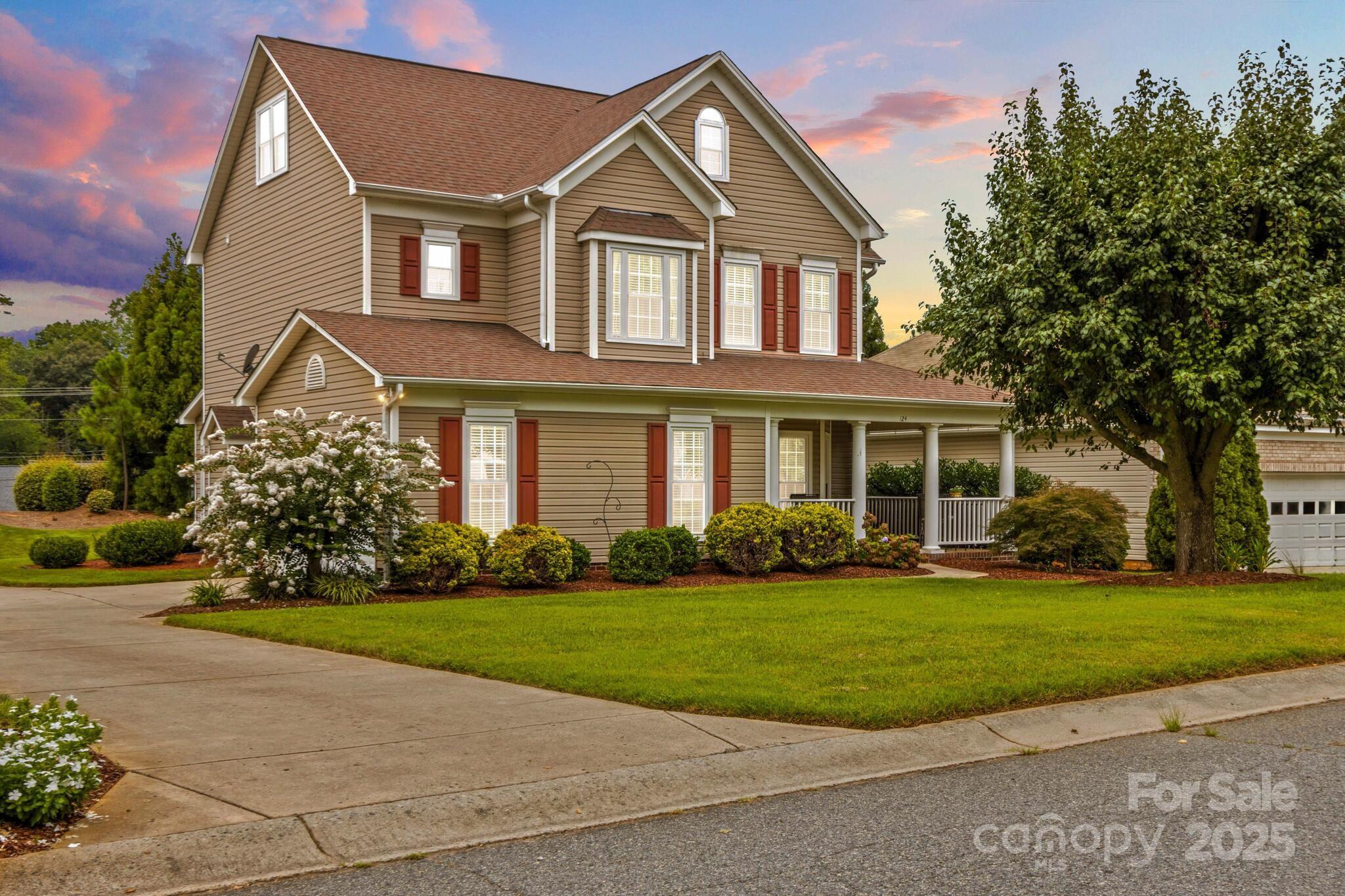 124 Elizabeth Hearth Road Mooresville, NC 28115 - Photo 6 of 48 a front view of a house with a yard and garage