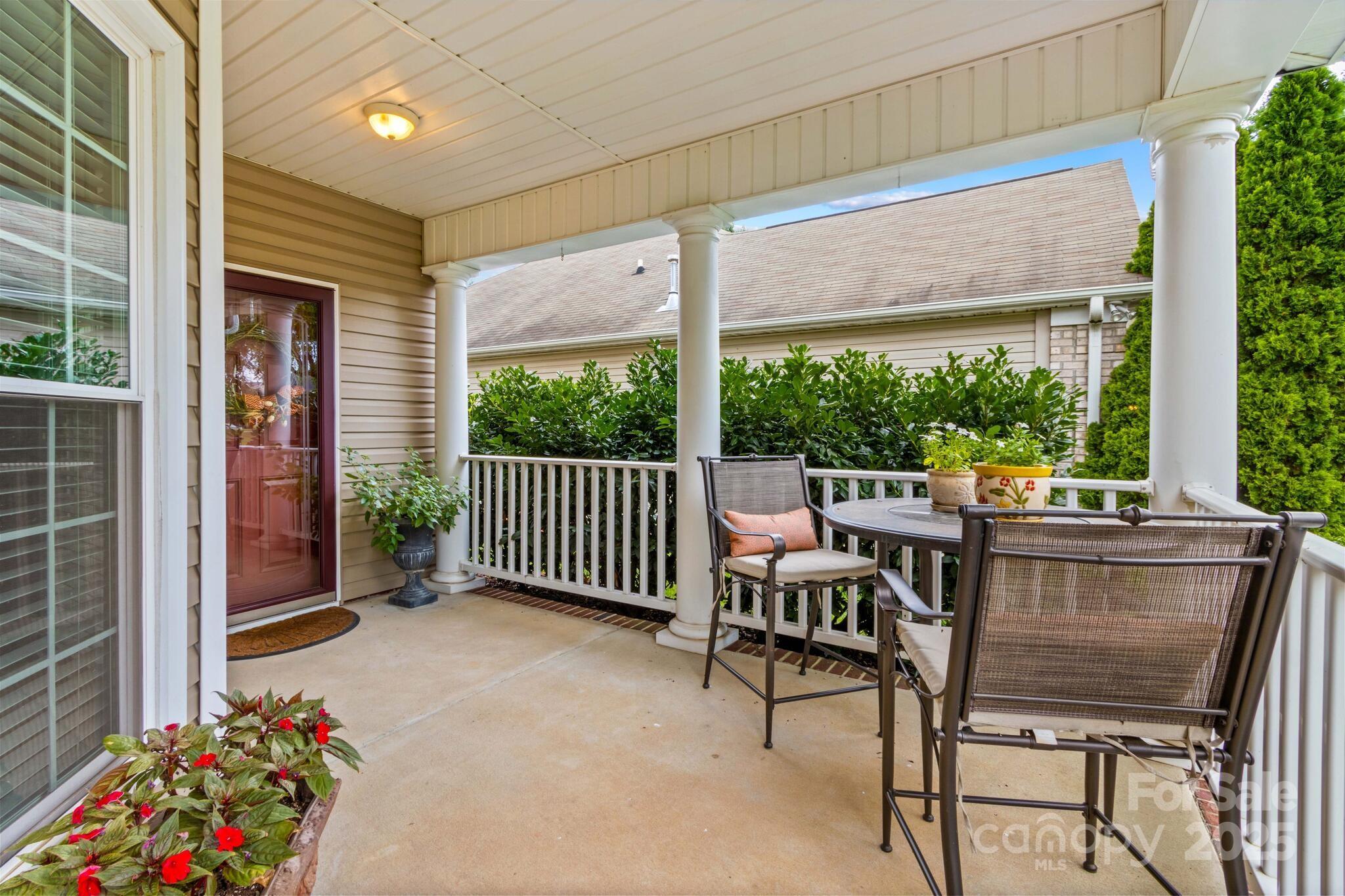 124 Elizabeth Hearth Road Mooresville, NC 28115 - Photo 8 of 48 a view of a chairs and table in the balcony