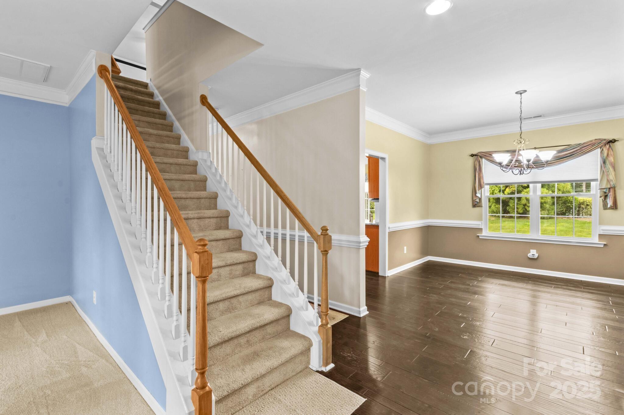 124 Elizabeth Hearth Road Mooresville, NC 28115 - Photo 9 of 48 a view of an entryway with wooden floor and door