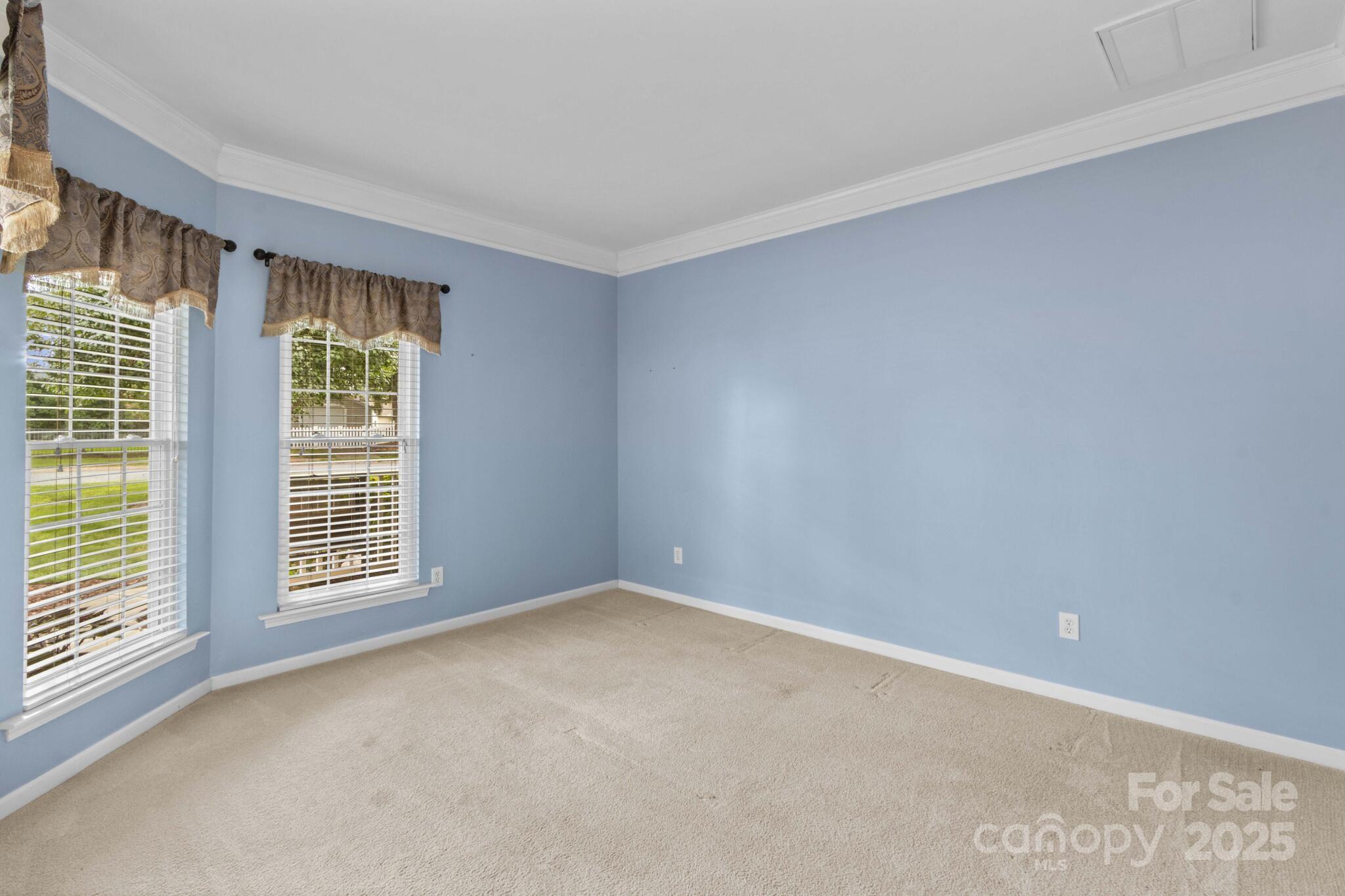 124 Elizabeth Hearth Road Mooresville, NC 28115 - Photo 10 of 48 a view of an empty room with a window
