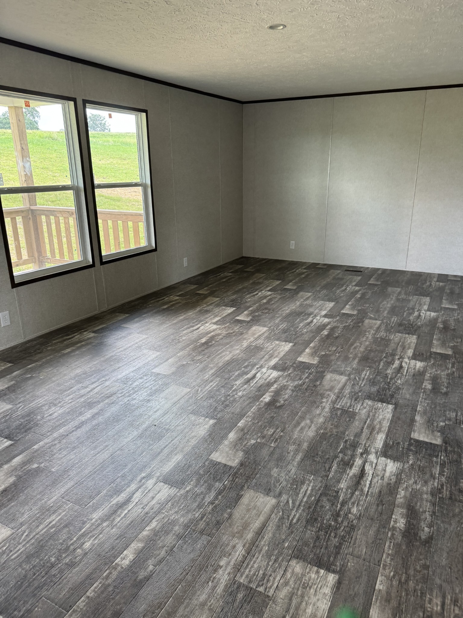 9494 Sunrise Road Red Boiling Springs, TN 37150 - Photo 3 of 10 an empty room with windows