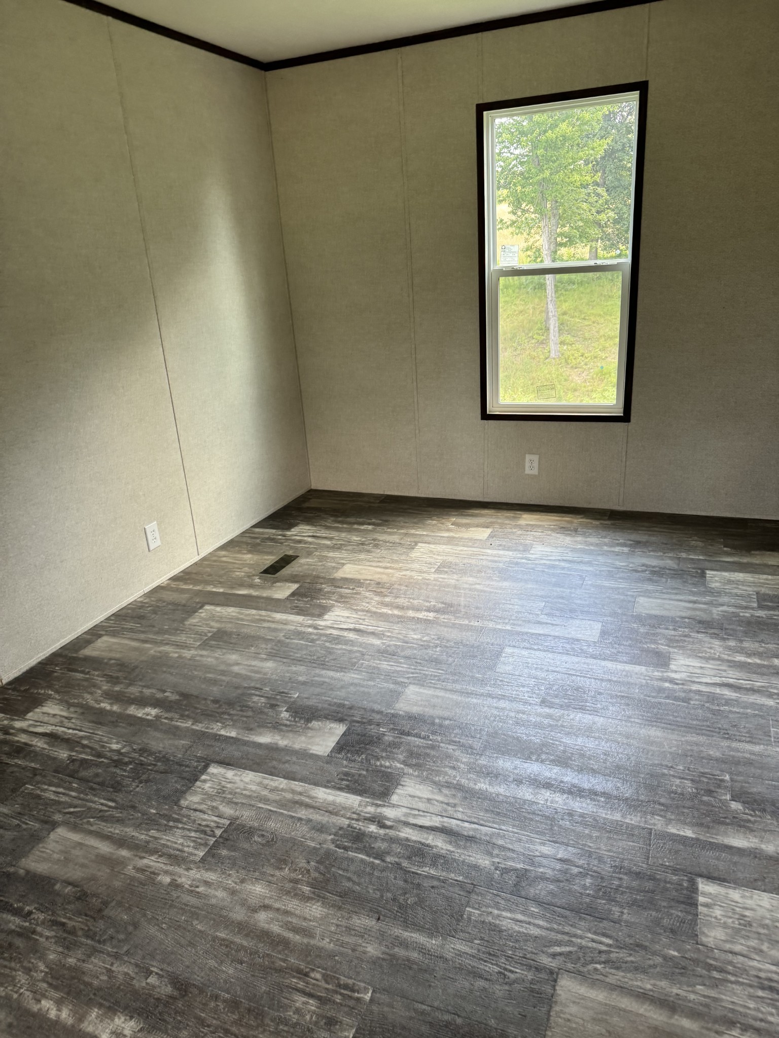 9494 Sunrise Road Red Boiling Springs, TN 37150 - Photo 5 of 10 a view of an empty room with a window