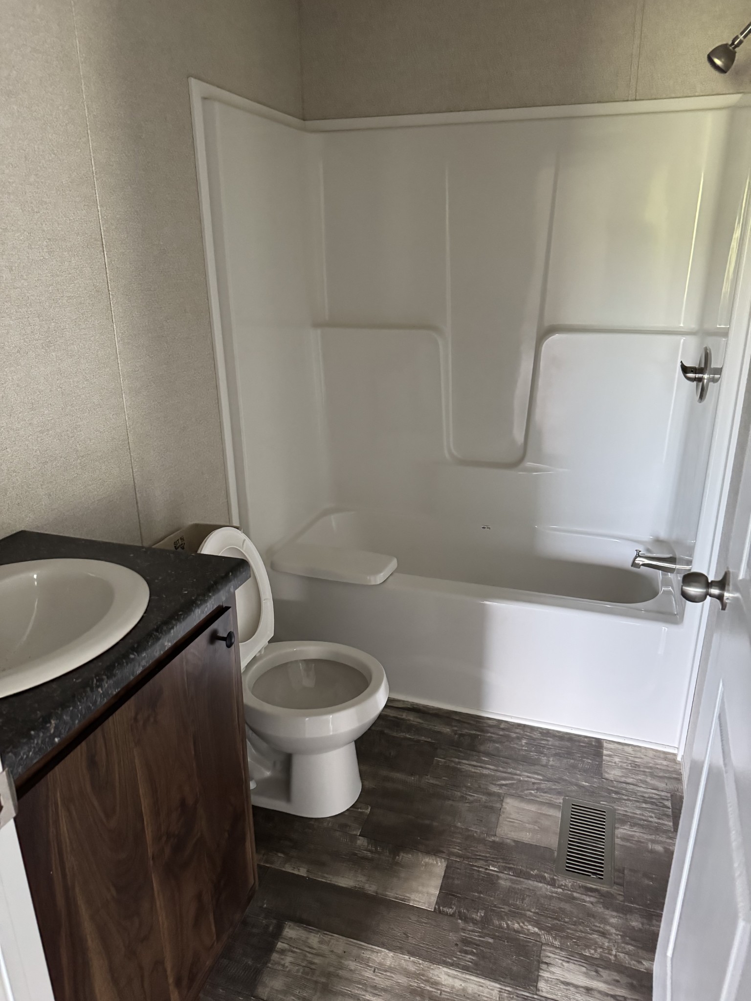 9494 Sunrise Road Red Boiling Springs, TN 37150 - Photo 9 of 10 a bathroom with a granite countertop sink toilet and a mirror