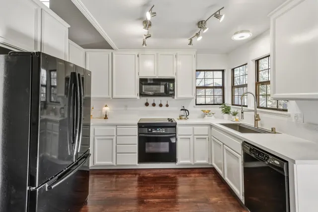 a kitchen with a sink stove and refrigerator