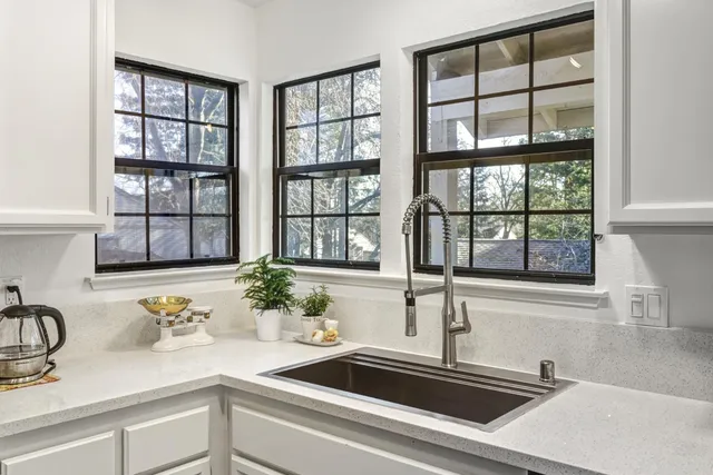 a kitchen with a sink and a window