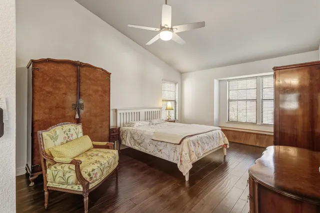 a bedroom with a bed window and a couch