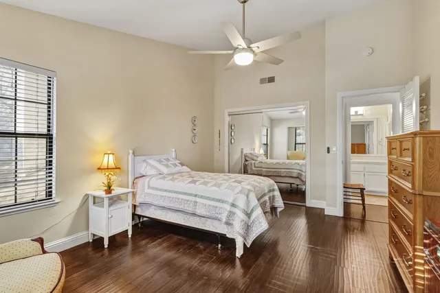 a bedroom with a bed and window