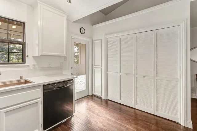 a kitchen with a sink and cabinets