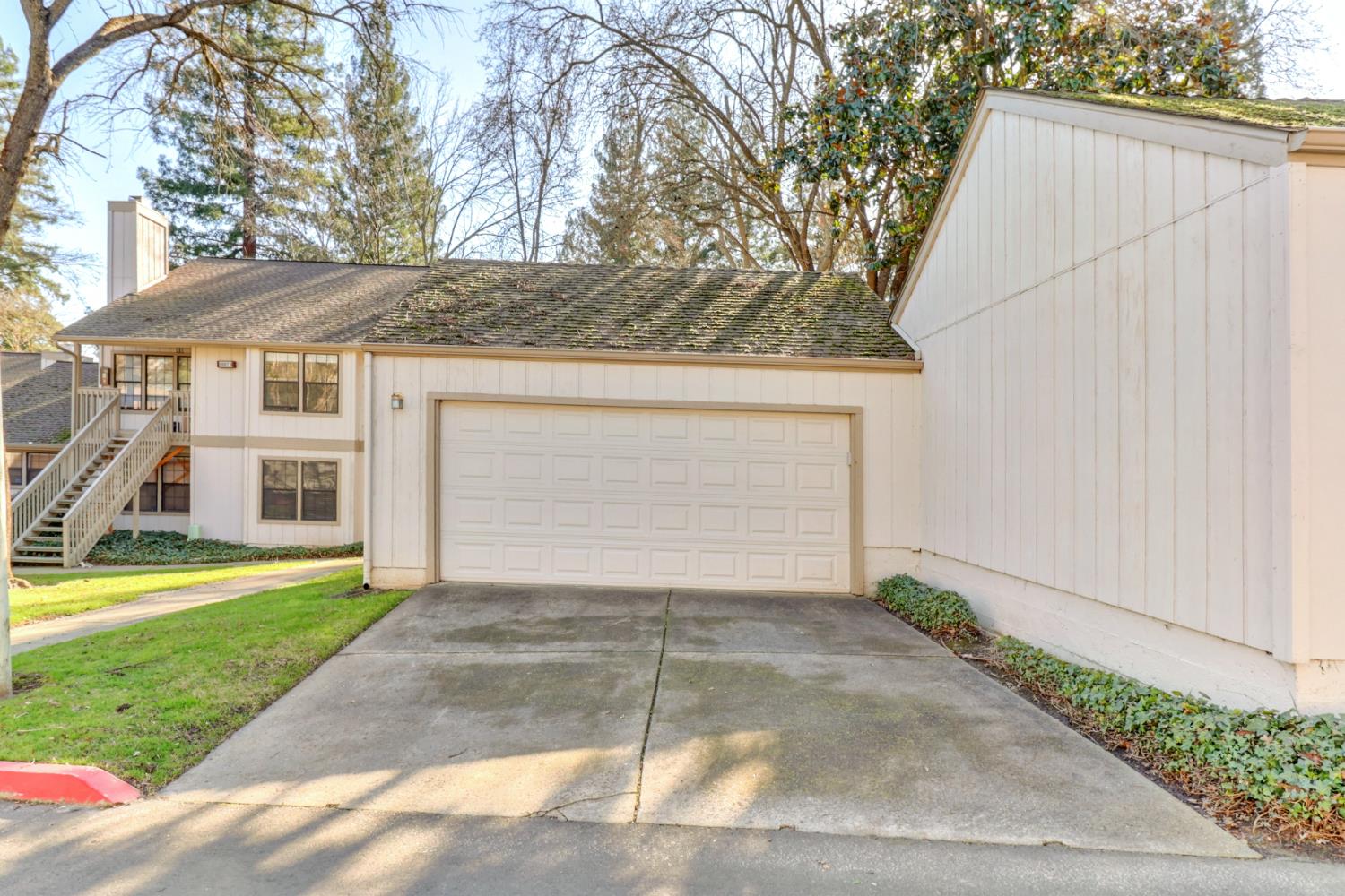 3901 Park Cir Lane, Unit B Carmichael, CA 95608 - Photo 36 of 40 a view of a house with a yard and garage