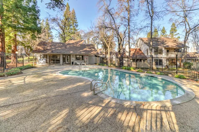 a view of a swimming pool with a patio
