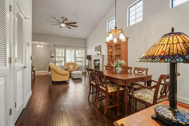 a view of a dining room with furniture and chandelier