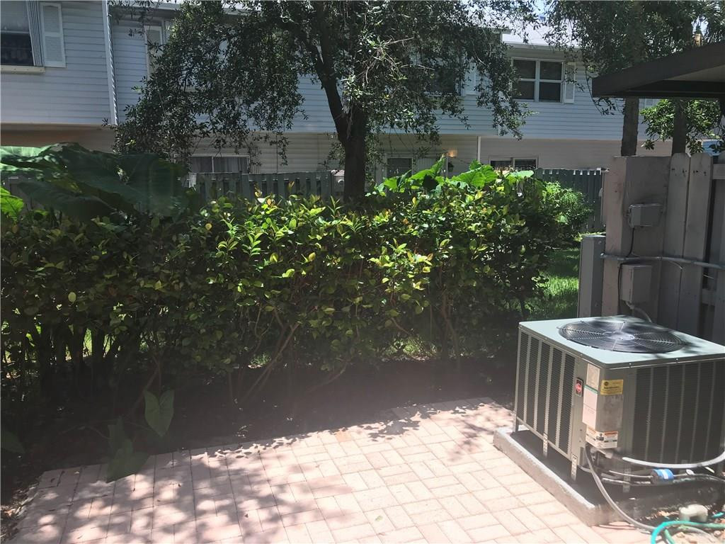 75 Southwest 3rd Street, Unit 75 Pompano Beach, FL 33060 - Photo 1 of 2 a backyard of a house with lots of green space
