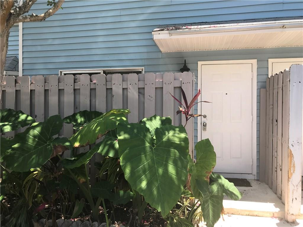 75 Southwest 3rd Street, Unit 75 Pompano Beach, FL 33060 - Photo 2 of 2 a view of a potted plant in front of a window
