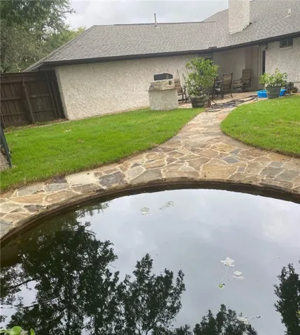 a front view of a house with a yard and a garage